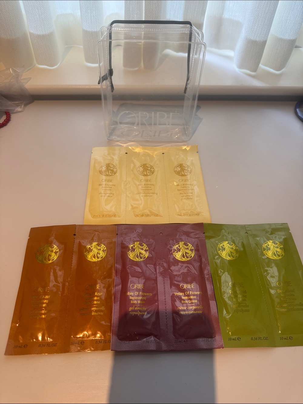 Oribe Travel Pouch w/ 3 Body Wash & Creme Hair Alchemy Shampoo Conditioner Serum